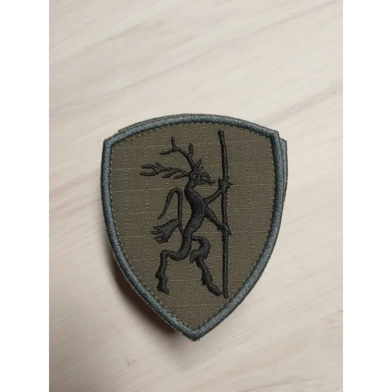 Emblemat z logo klubu strzeleckiego KSGlauberyt